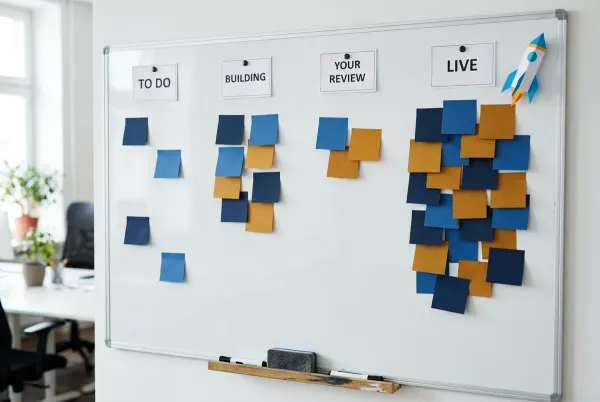 project board with To Do, Building, Your Review, and Live columns and a paper rocket at Live